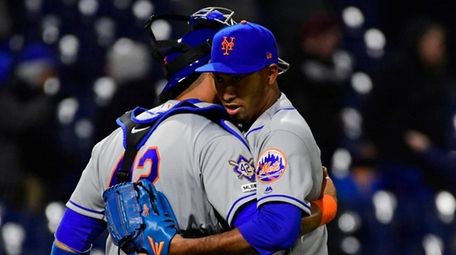 Mets reliever Edwin Diaz hugs catcher Wilson Ramos
