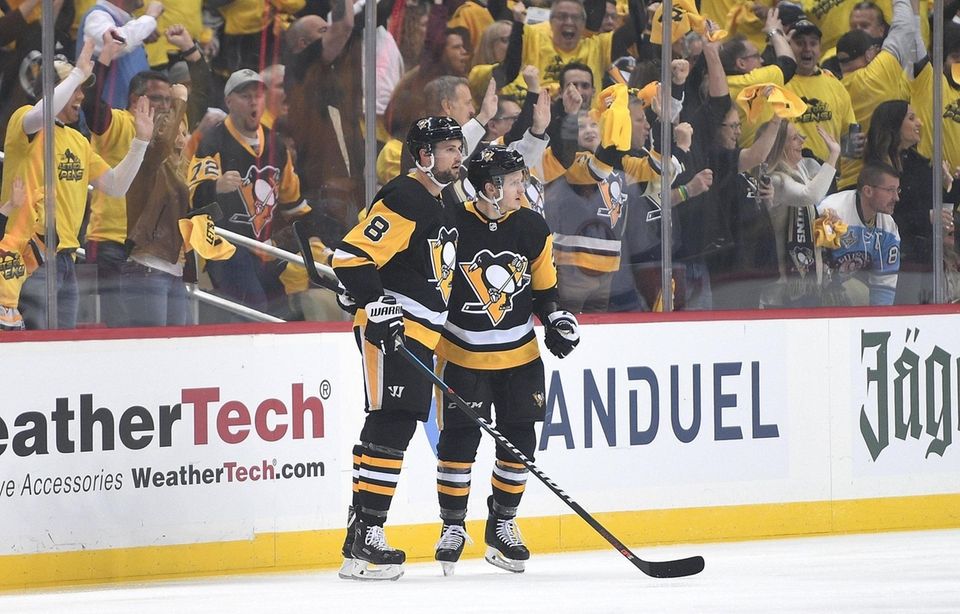 Jake Guentzel of the Penguins celebrates with Brian