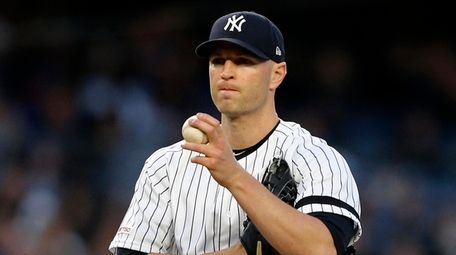 J.A. Happ of the Yankees looks on against