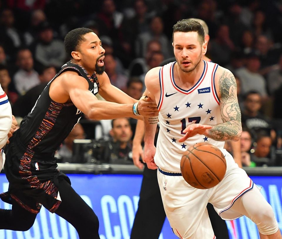 Nets guard Spencer Dinwiddie (8) defends 76ers guard