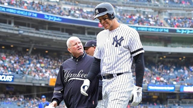 Aaron Judge of the Yankees is checked by... Aaron Judge of the Yankees is checked by