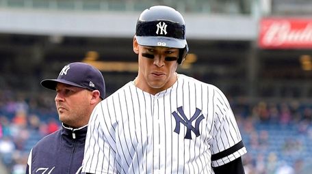 Aaron Judge reacts after suffering an injury against