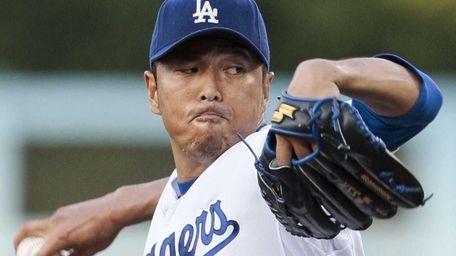 Los Angeles Dodgers starting pitcher Hiroki Kuroda throws