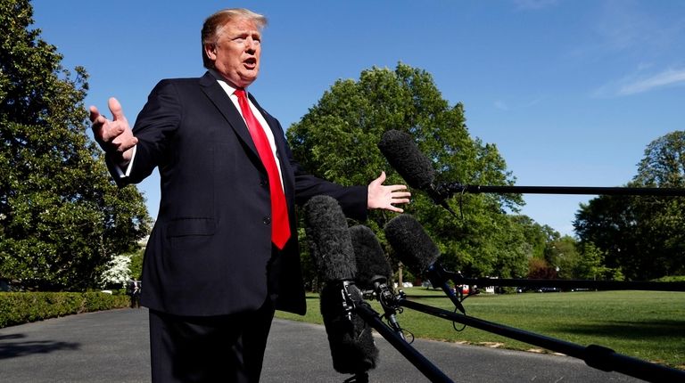 President Donald Trump speaks to the media outside