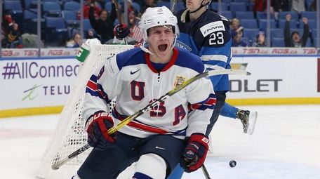 Adam Fox of the United States celebrates after