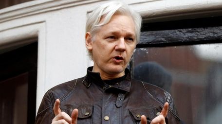 WikiLeaks founder Julian Assange outside the Ecuadorian embassy