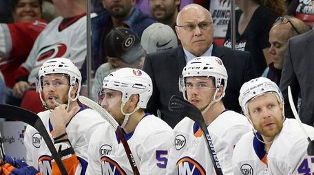 Islanders coach Barry Trotz looks on during the