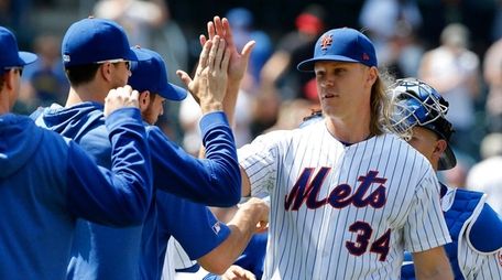 Noah Syndergaard #34 of the Mets celebrates with