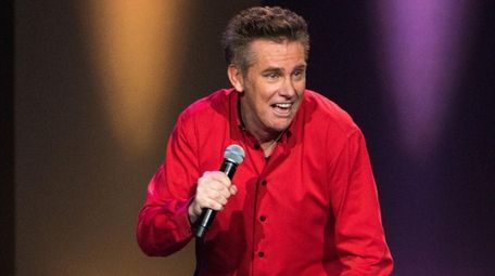 Comedian Brian Regan works his stand-up gig with