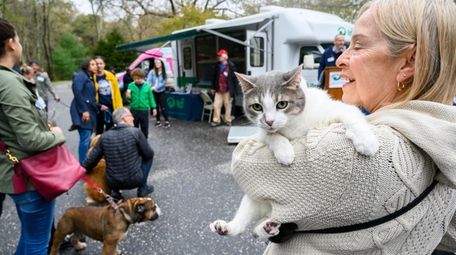 Pat Maloney, of East Hampton, holds her cat,