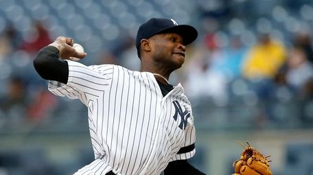 Domingo German #55 of the Yankees pitches during