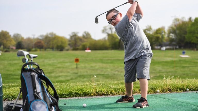 Declan Stack, 7, of Hicksville, who golfs with