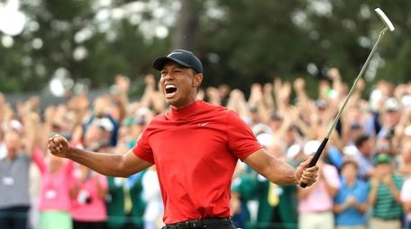 Tiger Woods of the United States celebrates after