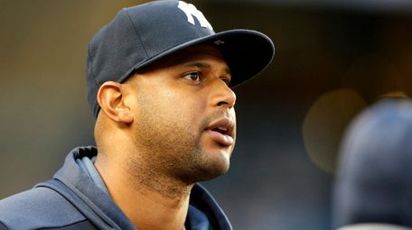 Aaron Hicks of the Yankees looks on from
