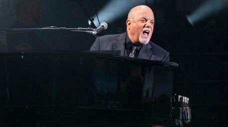 Billy Joel performs during a concert that also
