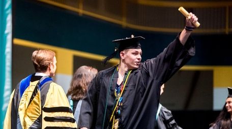 A graduate celebrates during LIU Post's commencement Friday.
