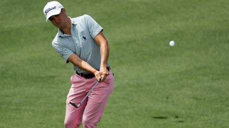 Justin Thomas hits to the second green during