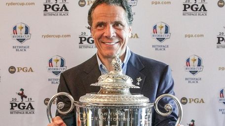 Gov. Andrew M. Cuomo with the Wanamaker Trophy,