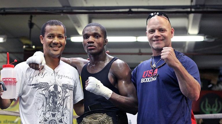 Titus Williams (Middle) poses with trainer Joe Higgins