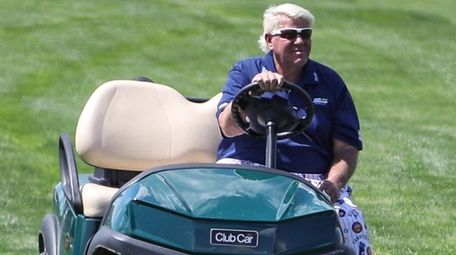John Daly drives the 16th fairway at the