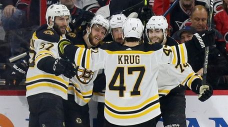 Boston Bruins' Patrice Bergeron, David Pastrnak, Brad Marchand,