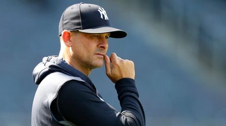 Manager Aaron Boone of the Yankees looks on