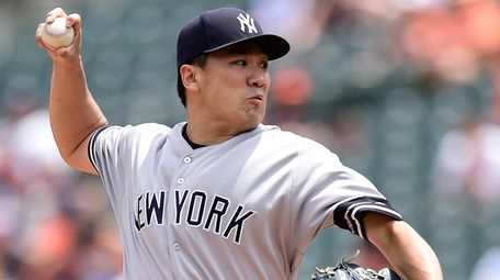 Yankees starter Masahiro Tanaka pitches in the first