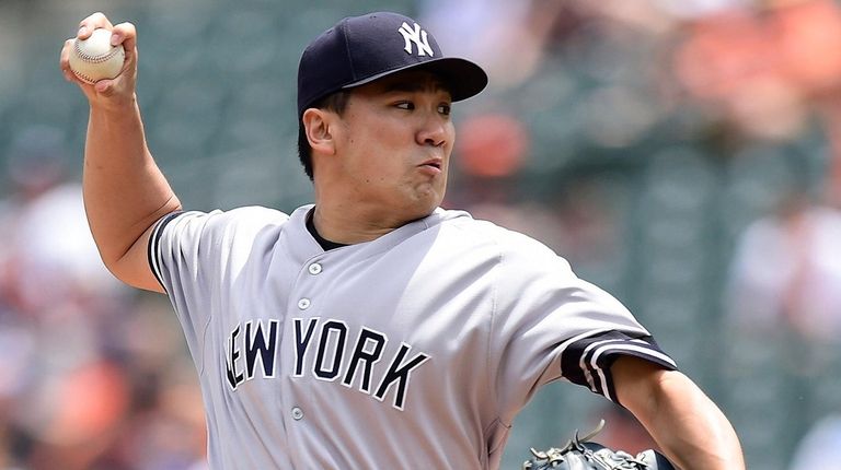 Yankees starter Masahiro Tanaka pitches in the first