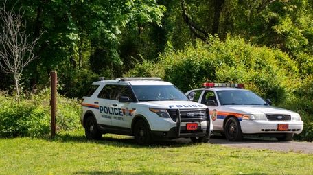 Nassau police at the Massapequa Preserve on Saturday.
