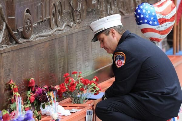 A New York firefighter pauses at the firefighters