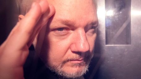 Wikileaks co-founder Julian Assange, in a prison van,