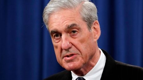 Special counsel Robert Mueller speaks at the Department