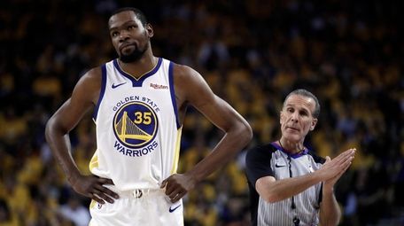 Kevin Durant of the Warriors walks away from