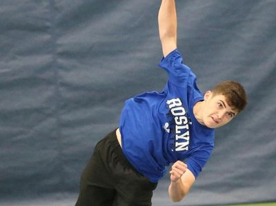 Roslyn's Mikey Weitz serves as he and teammate