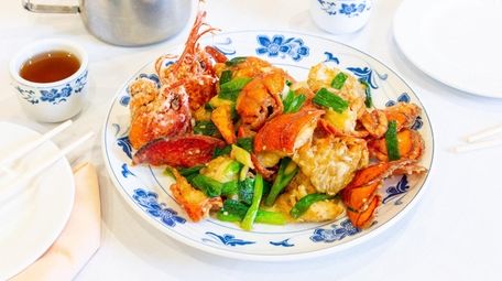Lobster stir fried with ginger and scallions is