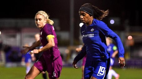 Crystal Dunn of Chelsea Ladies goes past Steph