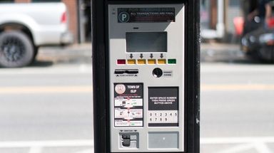 Parking meters along Bay Shore's Main Street, pictured