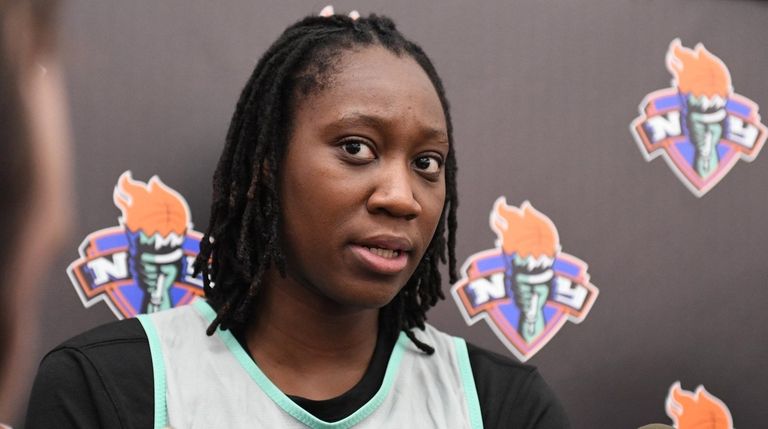 Liberty center Tina Charles speaks to the press