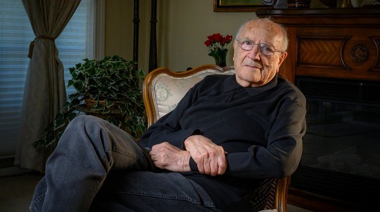 Arnold Fishler, 90, at his Melvillle home Tuesday.