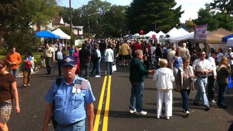 Long Island Fall Festival attendees gather on Madison