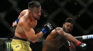Aljamain Sterling punches Pedro Munhoz during UFC 238