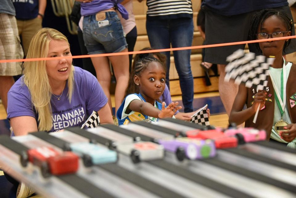 Madison Charles, 6, of East Meadow, center, watches