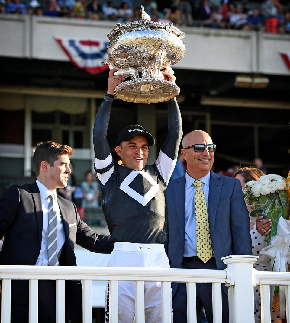 Jockey Joel Rosario celebrates in the winners circle