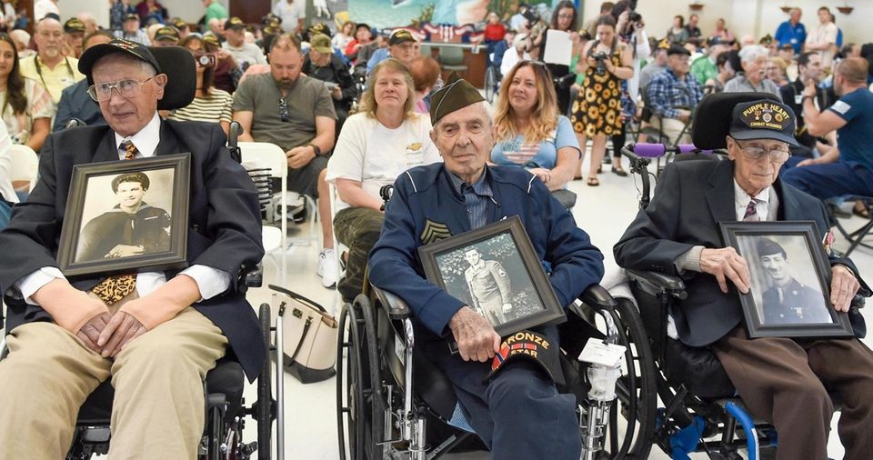 Normandy heroes Charles Cino, left, Phillip DiMarco and