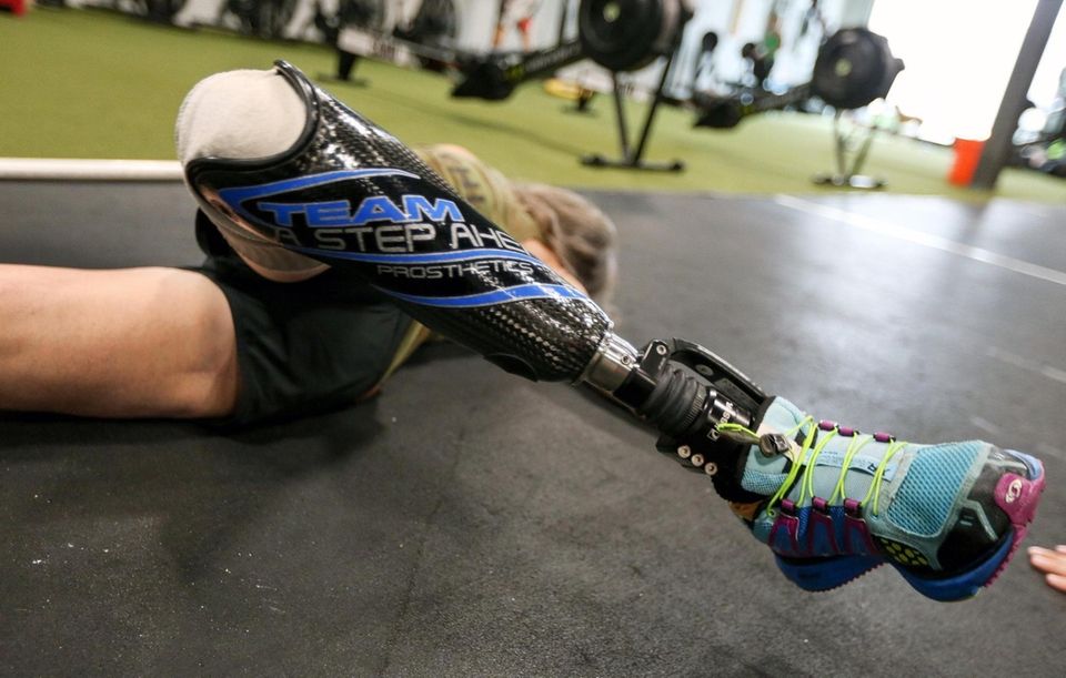 Amy Palmiero-Winters stretches at Crossfit Camo, in Farmingdale,