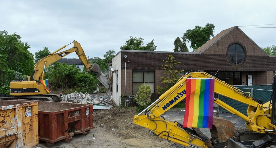 Demolition crews demolish the site of the former