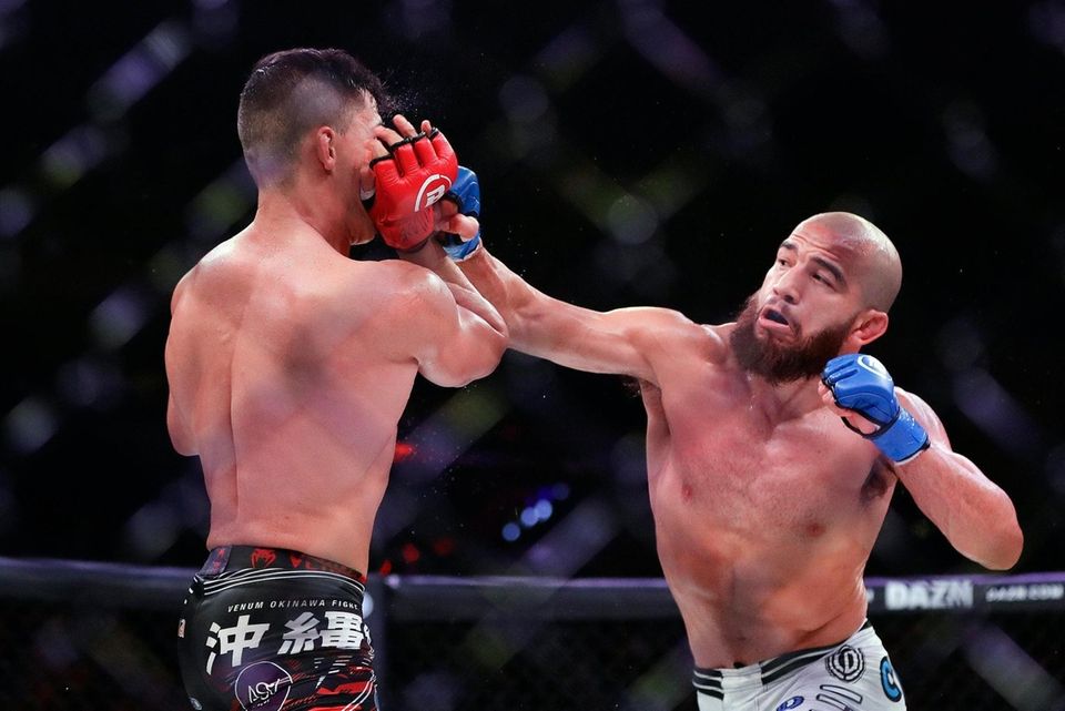 Juan Archuleta, right, punches Brazil's Eduardo Dantas during