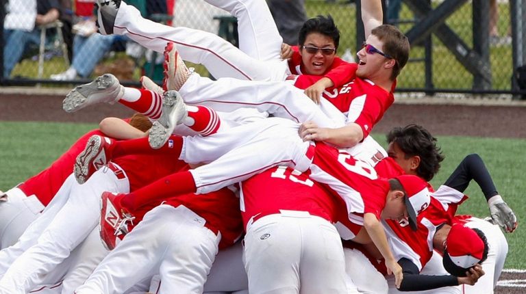 Center Moriches' Dylan Bryant and teammates celebrate after