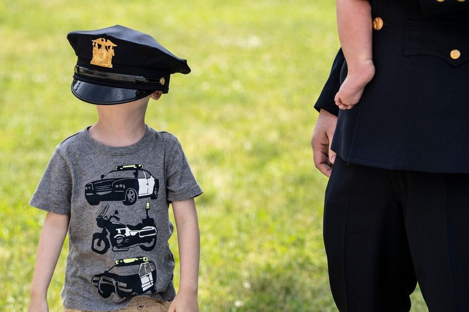 Carter Finnerty, 4 wears his father's hat, Suffolk