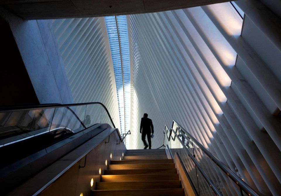 A person walks up step to an upper